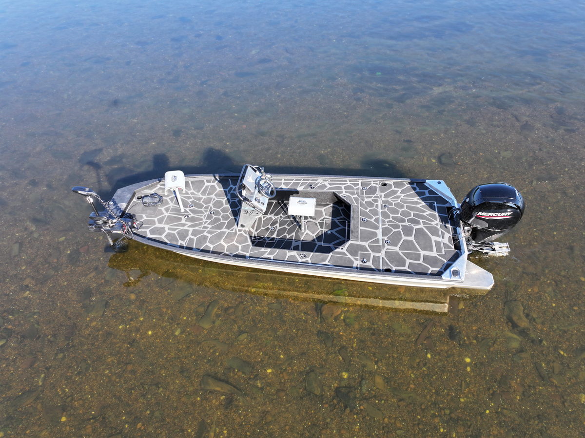 The SR 60 Outboard Jet over a clear gravel bottom